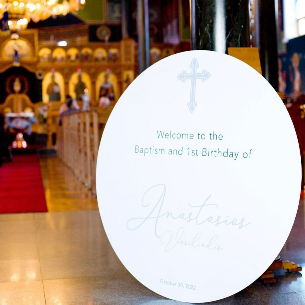 Printed welcome sign displayed at a baptism and first birthday celebration